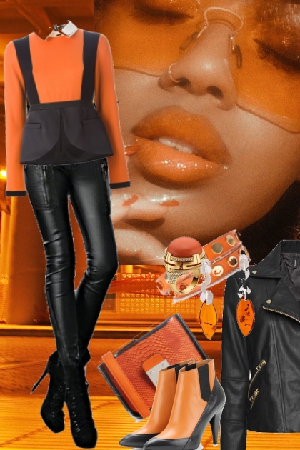 Sort skinnbukse og sort-oransje topp- Combinazione di moda