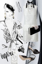 Hvit kjole og sorte smykker