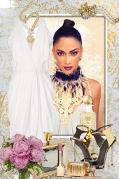Hvit kjole og gullsmykker