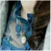 blue shirt and locket - People - 